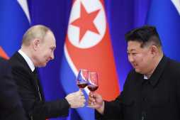Russian President Vladimir Putin and North Korean leader Kim Jong Un toast.